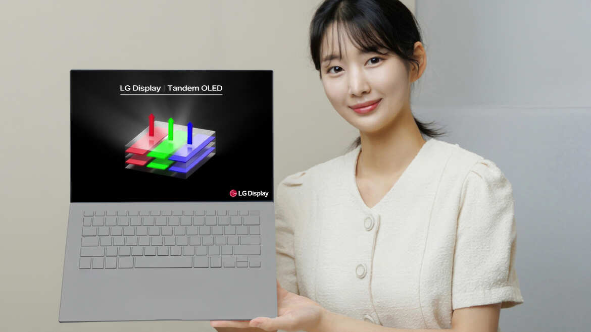 LG introduces Tandem OLED a woman holding a laptop